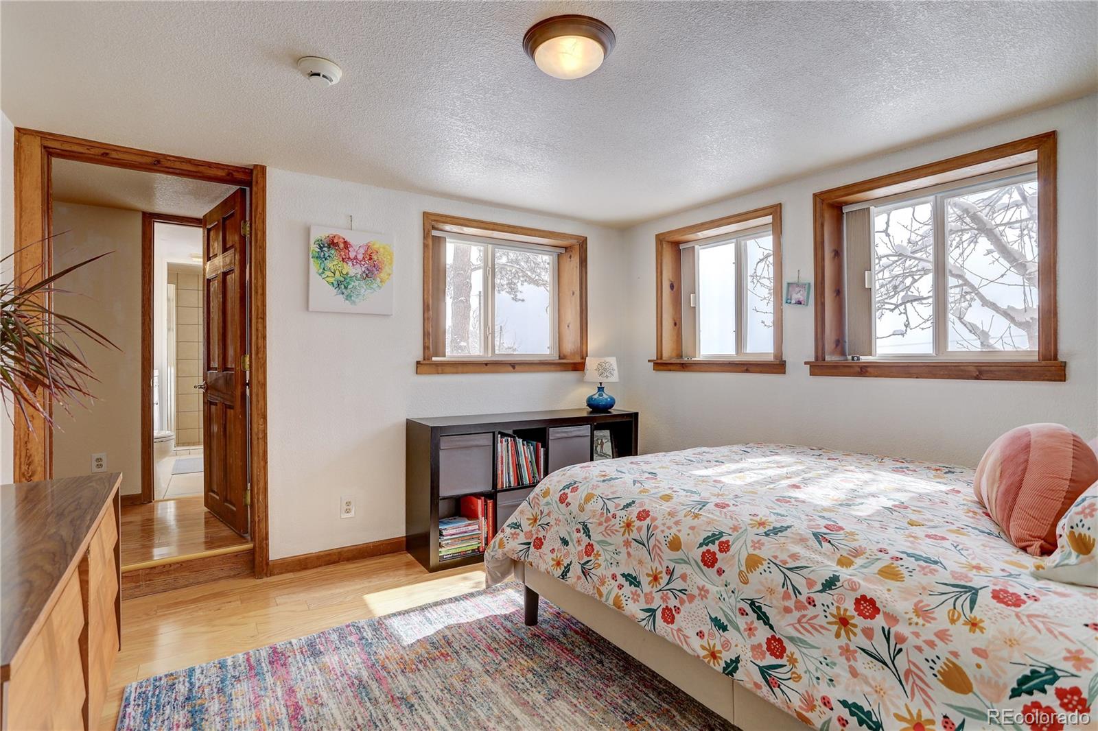 1094 Colorow Road Golden, CO 80401 - Photo 32 of 40 a bedroom with a bed and a window