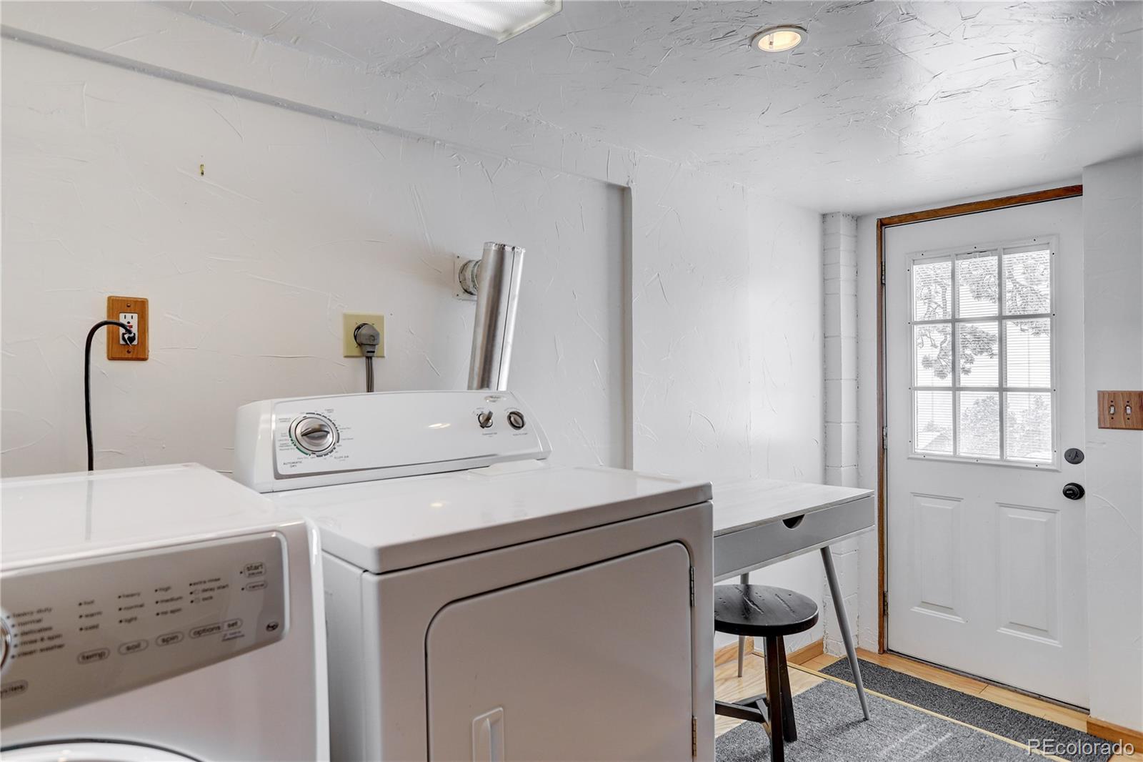 1094 Colorow Road Golden, CO 80401 - Photo 36 of 40 a utility room with dryer and washer