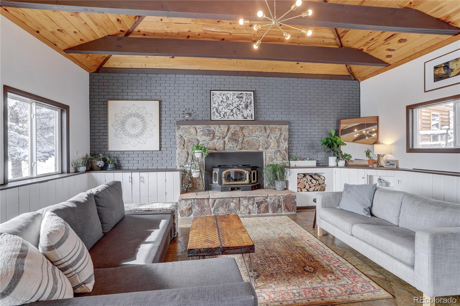 1094 Colorow Road Golden, CO 80401 - Photo 5 of 40 a living room with furniture and a fireplace