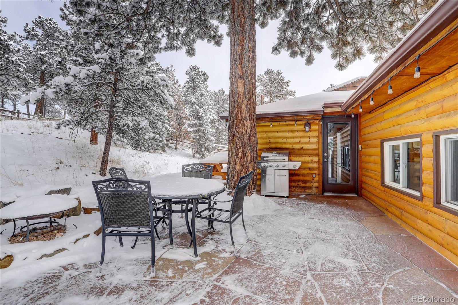 1094 Colorow Road Golden, CO 80401 - Photo 9 of 40 a view of a chairs and table in the patio