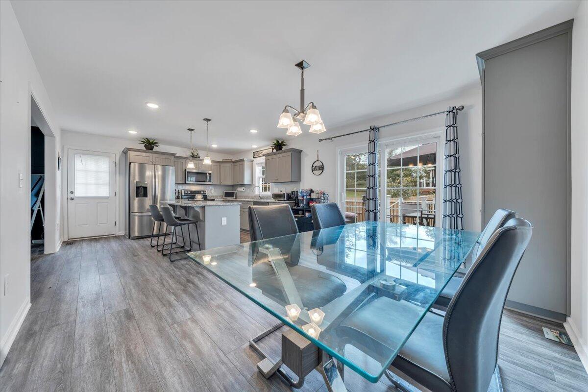 4018 Hazelridge Road Northwest Roanoke, VA 24012 - Photo 11 of 59 a dining room with furniture and wooden floor