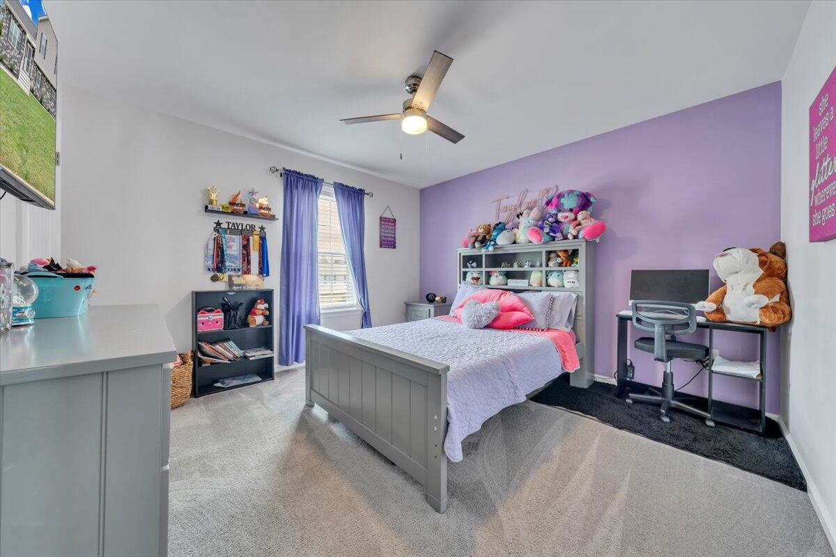 4018 Hazelridge Road Northwest Roanoke, VA 24012 - Photo 14 of 59 a bedroom with a bed and wooden floor