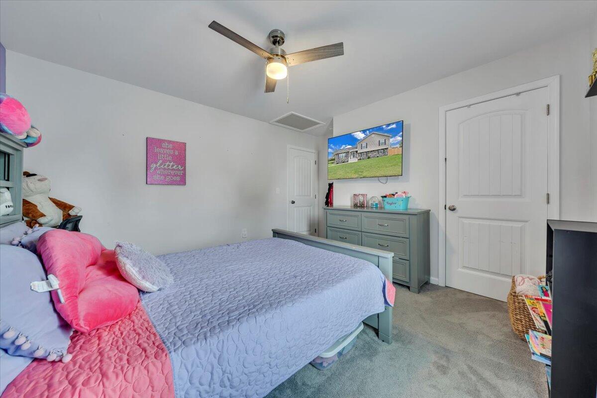 4018 Hazelridge Road Northwest Roanoke, VA 24012 - Photo 15 of 59 a bedroom with a bed and a flat screen tv
