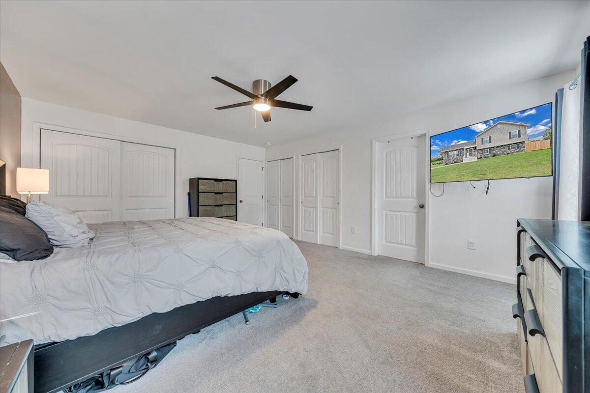 4018 Hazelridge Road Northwest Roanoke, VA 24012 - Photo 19 of 59 a bedroom with a bed and a tv