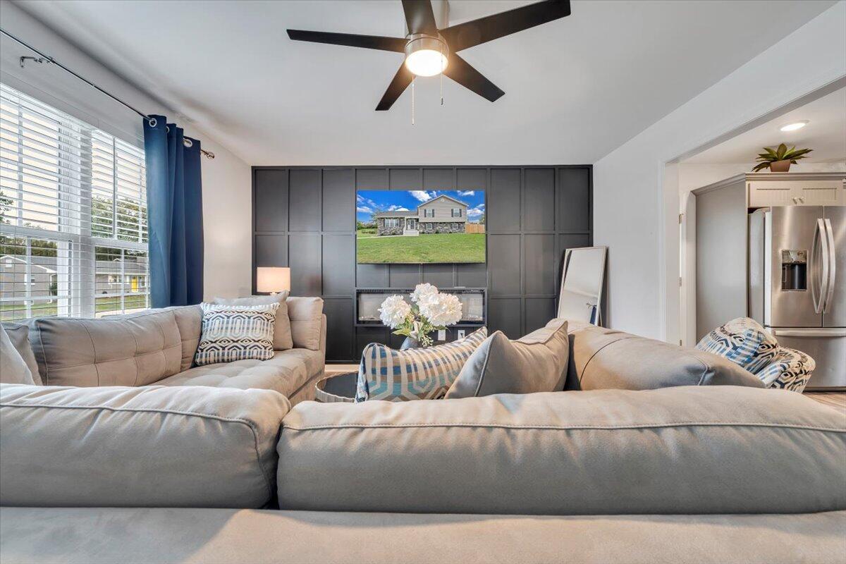 4018 Hazelridge Road Northwest Roanoke, VA 24012 - Photo 2 of 59 a living room with furniture and a flat screen tv