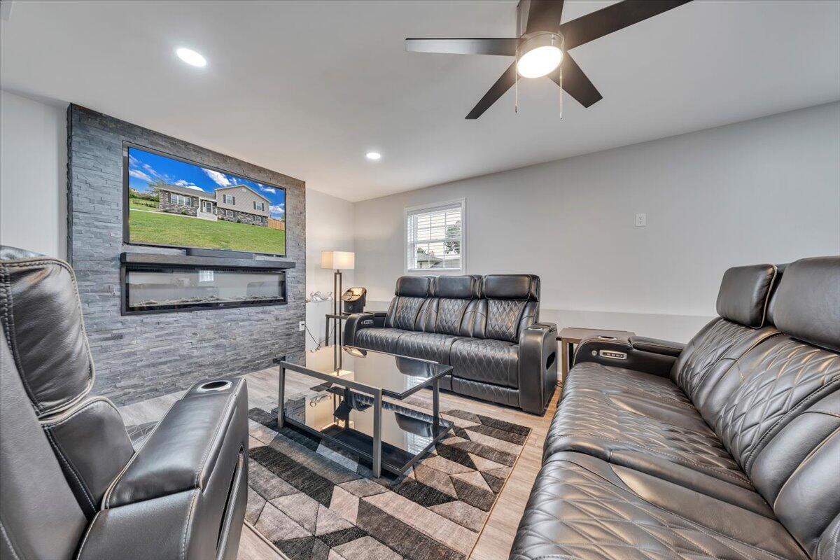 4018 Hazelridge Road Northwest Roanoke, VA 24012 - Photo 25 of 59 a living room with furniture and a flat screen tv