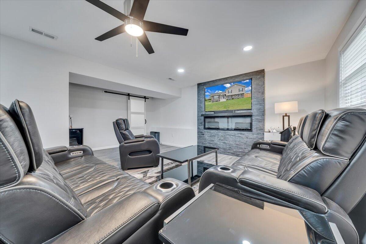 4018 Hazelridge Road Northwest Roanoke, VA 24012 - Photo 27 of 59 a living room with furniture and a flat screen tv