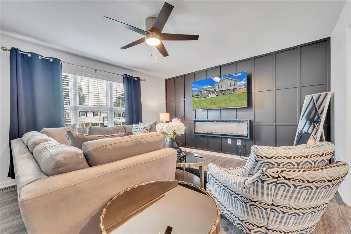 4018 Hazelridge Road Northwest Roanoke, VA 24012 - Photo 3 of 59 a living room with furniture and a flat screen tv