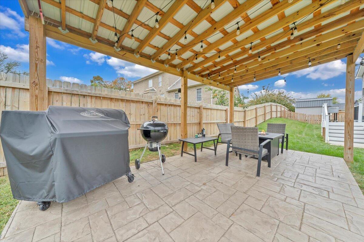 4018 Hazelridge Road Northwest Roanoke, VA 24012 - Photo 37 of 59 a view of a patio with a table and chairs and potted plants