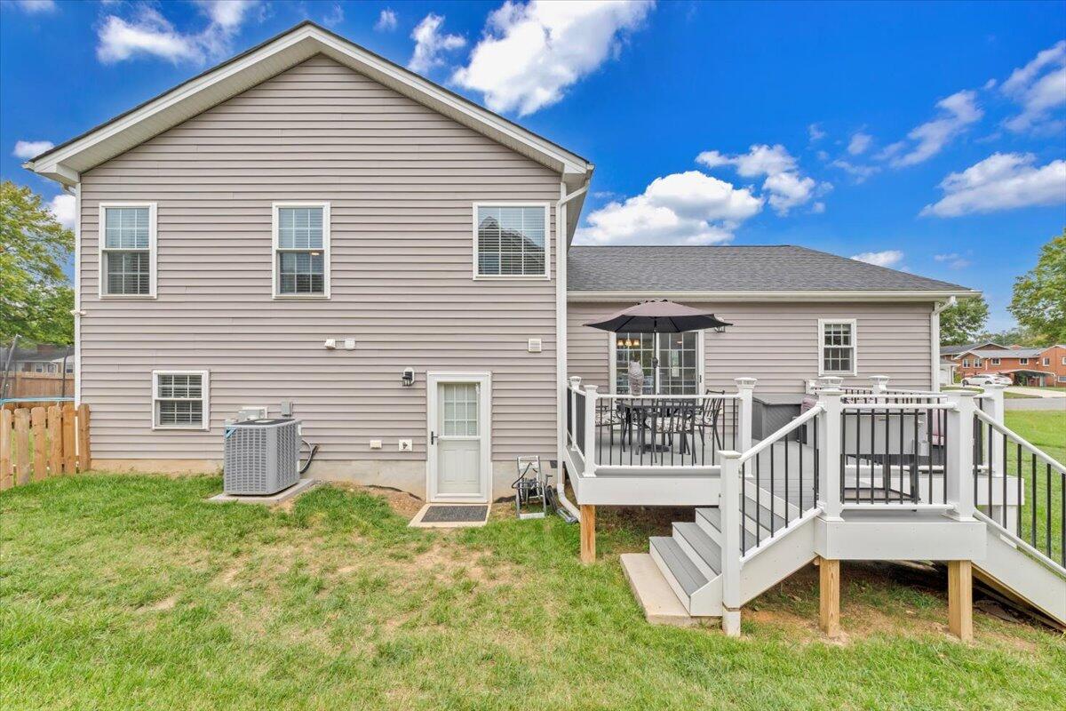 4018 Hazelridge Road Northwest Roanoke, VA 24012 - Photo 40 of 59 a view of a house with a deck and a yard
