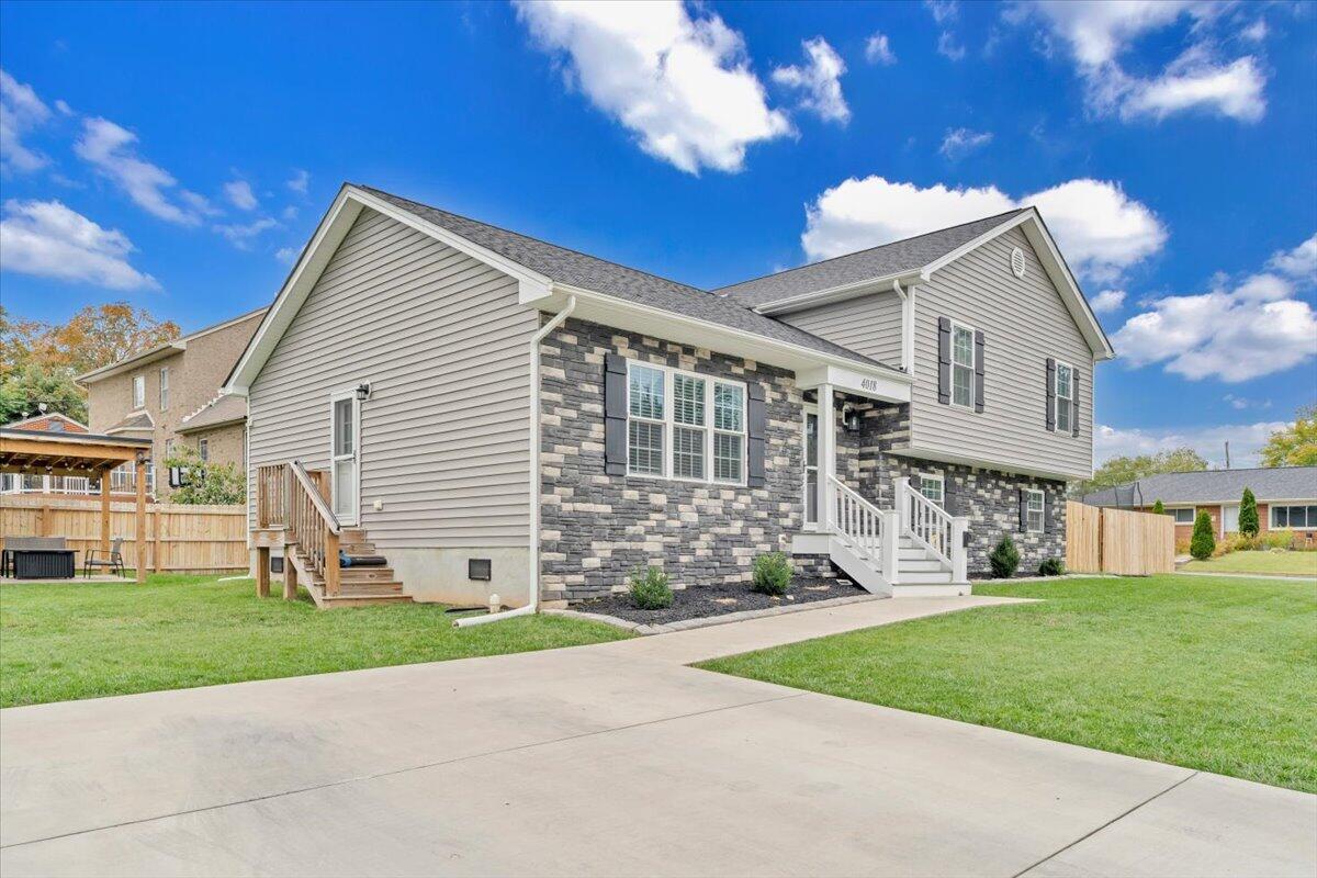 4018 Hazelridge Road Northwest Roanoke, VA 24012 - Photo 41 of 59 a view of a house with a yard