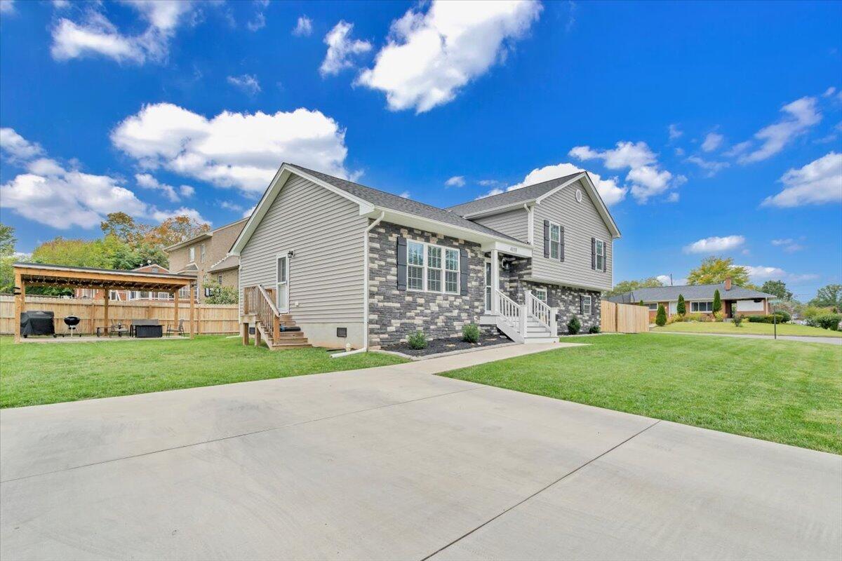 4018 Hazelridge Road Northwest Roanoke, VA 24012 - Photo 42 of 59 a view of a house with a yard