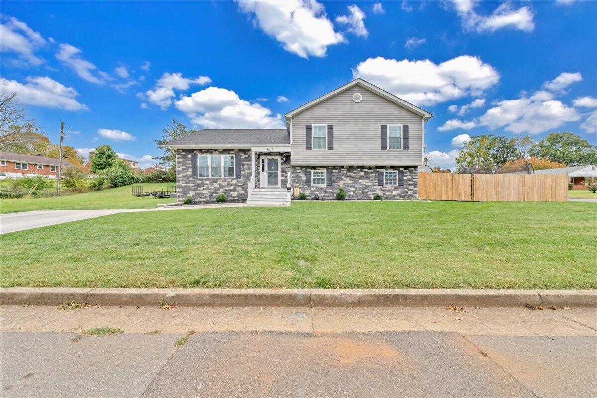 4018 Hazelridge Road Northwest Roanoke, VA 24012 - Photo 45 of 59 a front view of a house with a yard and garage