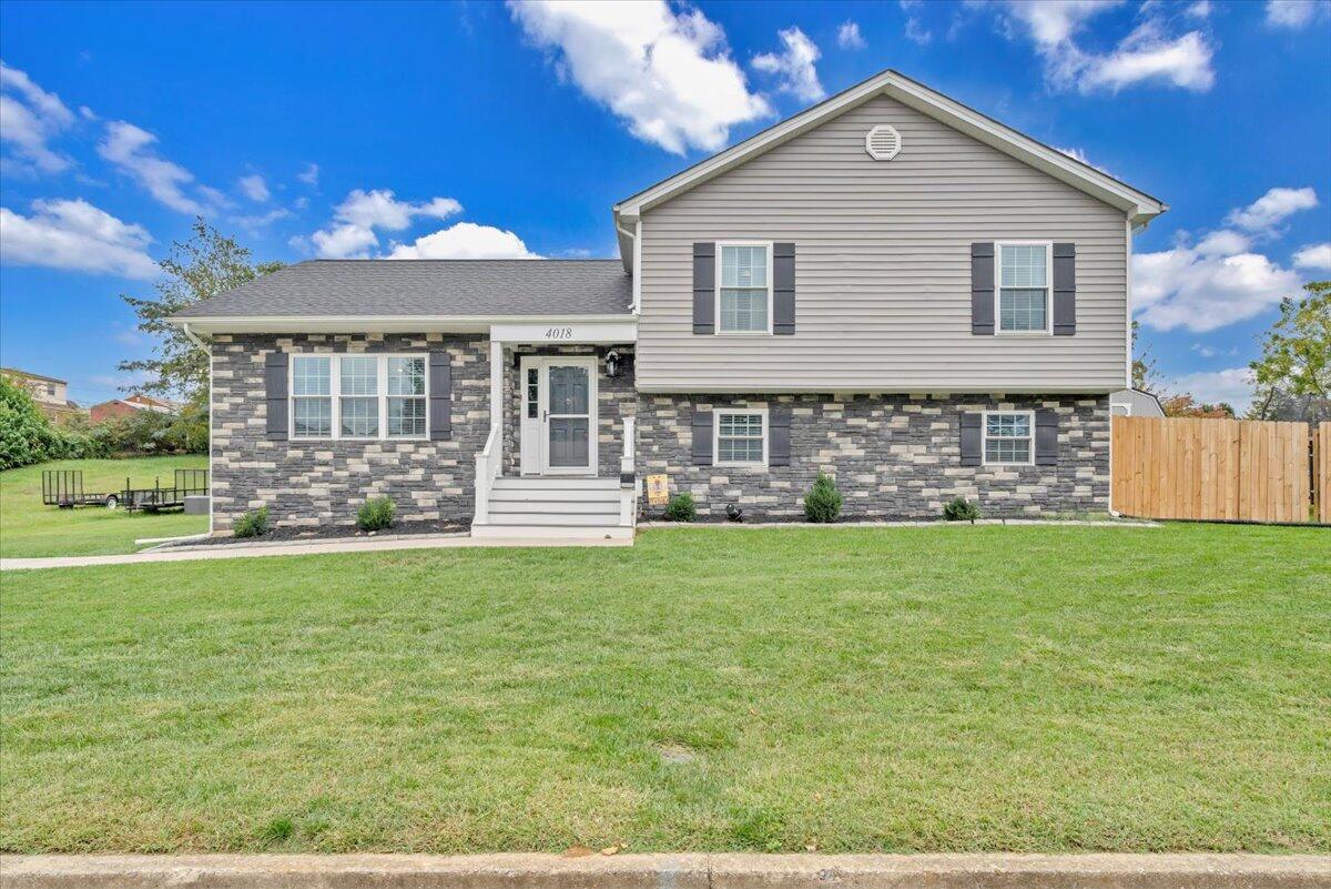 4018 Hazelridge Road Northwest Roanoke, VA 24012 - Photo 47 of 59 a front view of a house with a yard