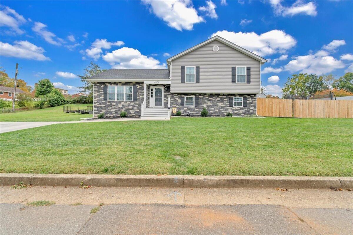 4018 Hazelridge Road Northwest Roanoke, VA 24012 - Photo 49 of 59 a front view of a house with a yard