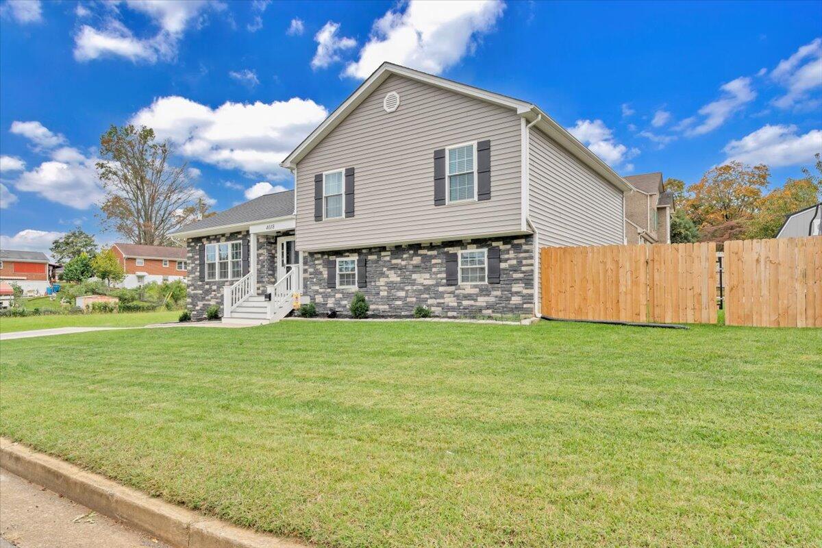 4018 Hazelridge Road Northwest Roanoke, VA 24012 - Photo 50 of 59 a front view of a house with a garden
