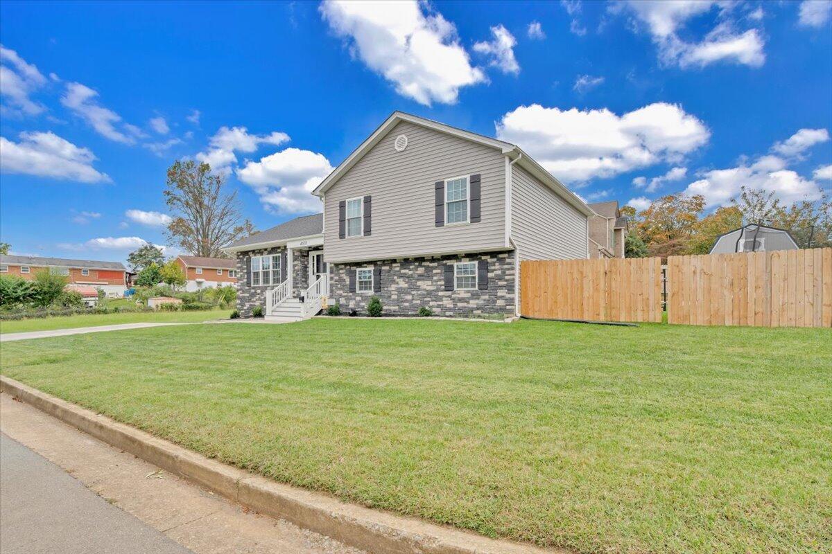 4018 Hazelridge Road Northwest Roanoke, VA 24012 - Photo 51 of 59 a view of a house with a yard
