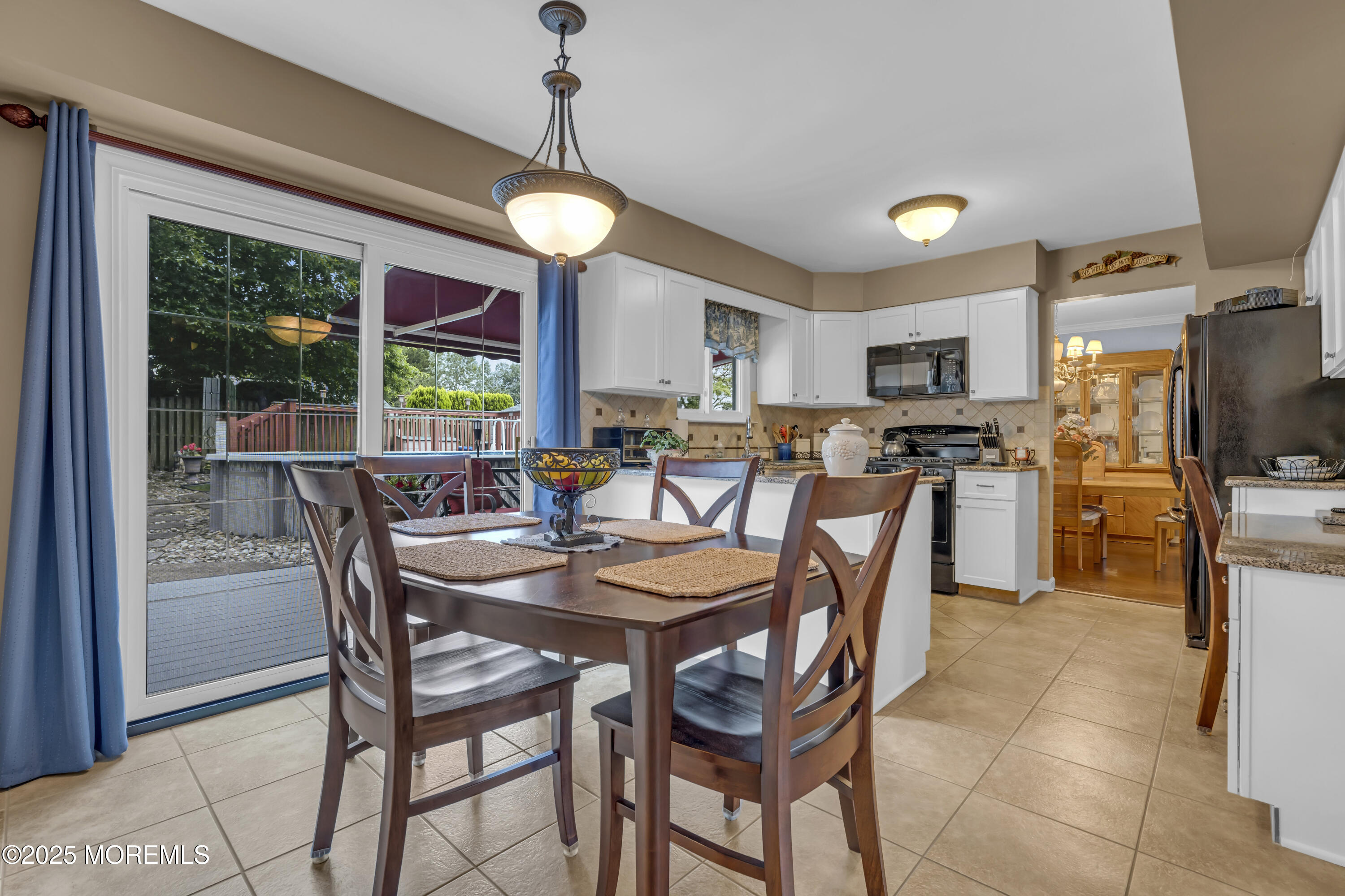 32 Kiwi Loop Howell, NJ 07731 - Photo 14 of 42 a view of a dining room with furniture window and outside view