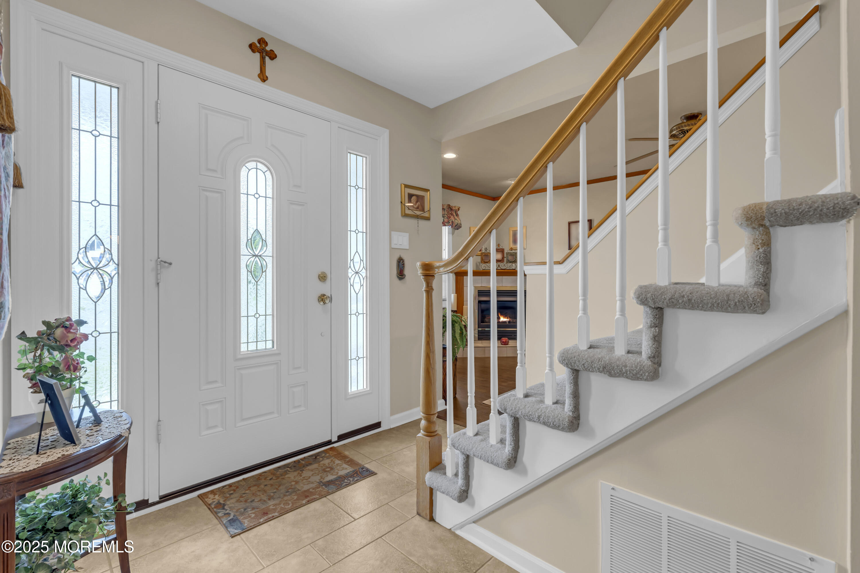 32 Kiwi Loop Howell, NJ 07731 - Photo 17 of 42 a view of entryway and hall with wooden floor
