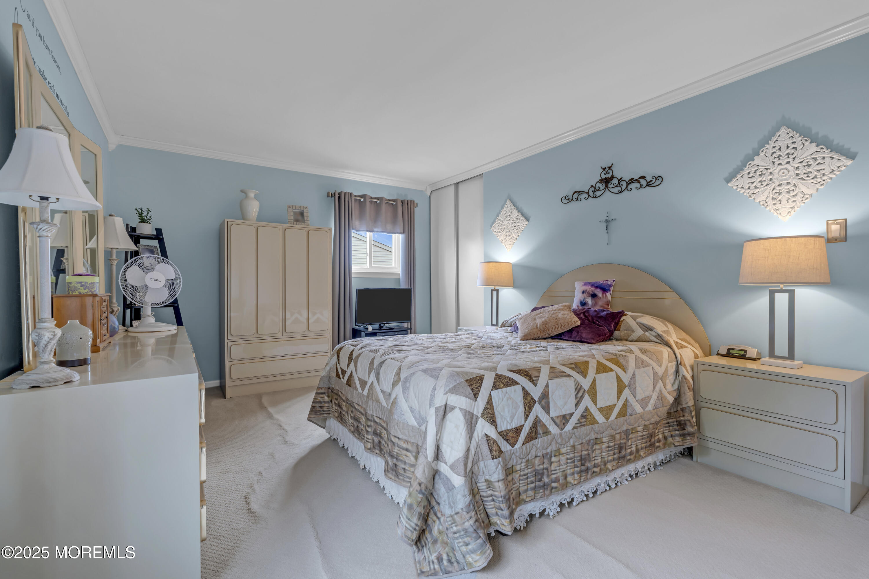 32 Kiwi Loop Howell, NJ 07731 - Photo 23 of 42 a bedroom with a bed and a lamp on table