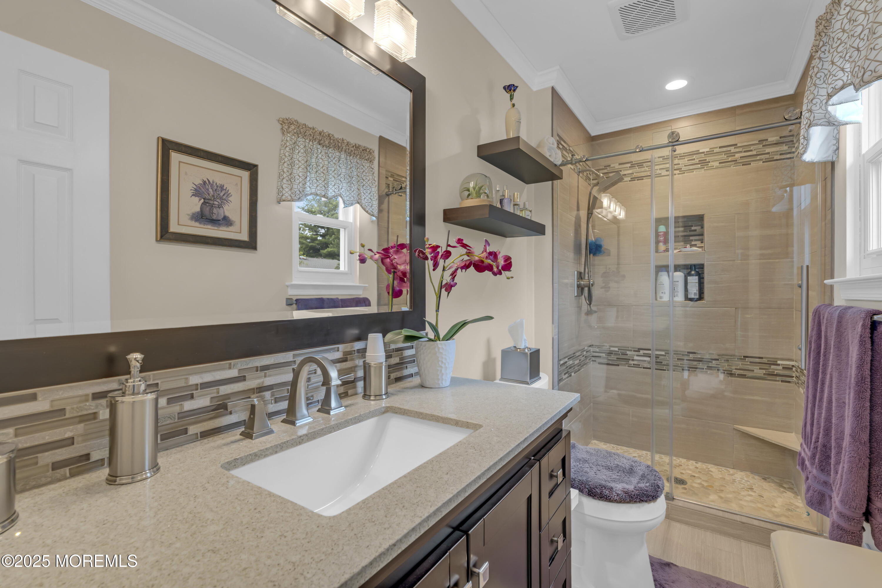 32 Kiwi Loop Howell, NJ 07731 - Photo 24 of 42 a bathroom with a granite countertop sink a mirror a bathtub and shower