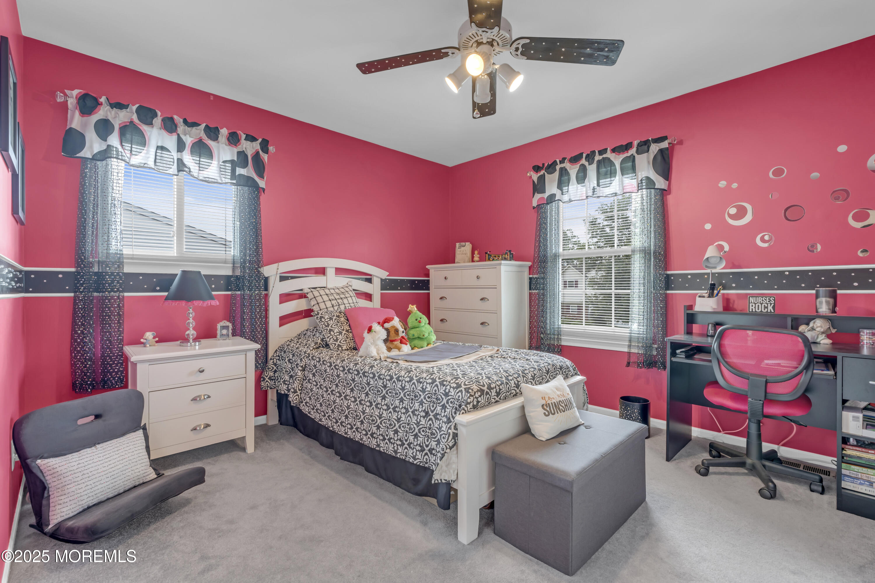 32 Kiwi Loop Howell, NJ 07731 - Photo 26 of 42 a bedroom with a bed and a chandelier