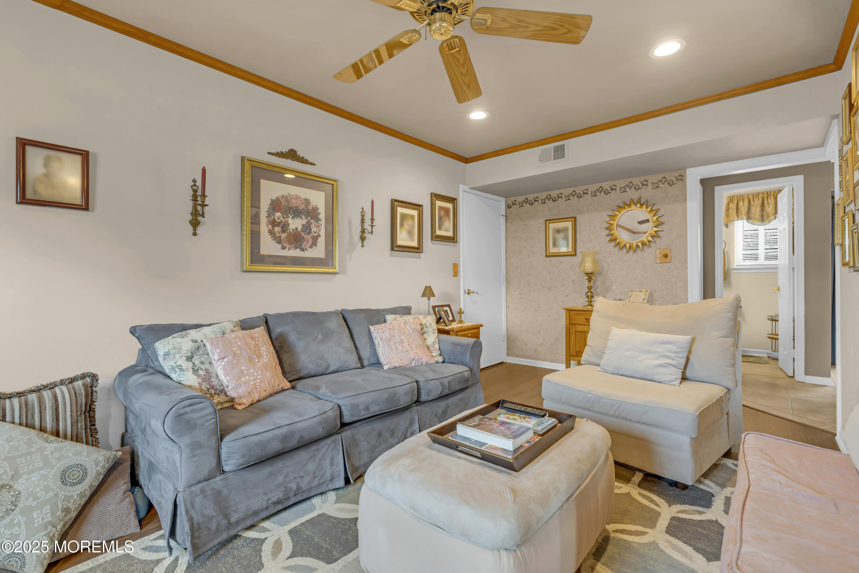 32 Kiwi Loop Howell, NJ 07731 - Photo 27 of 42 a living room with furniture and a wooden floor