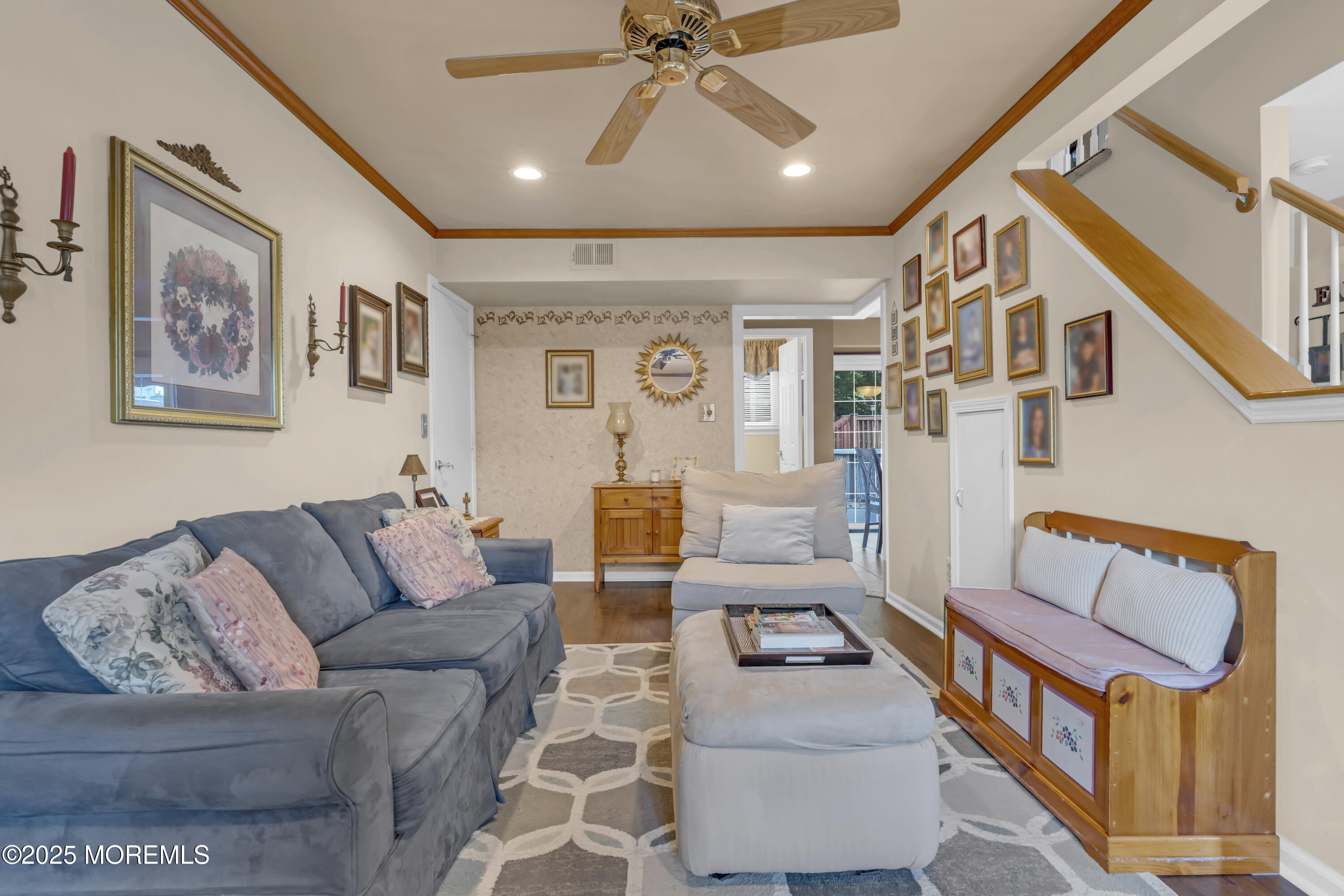 32 Kiwi Loop Howell, NJ 07731 - Photo 28 of 42 a living room with furniture and a ceiling fan