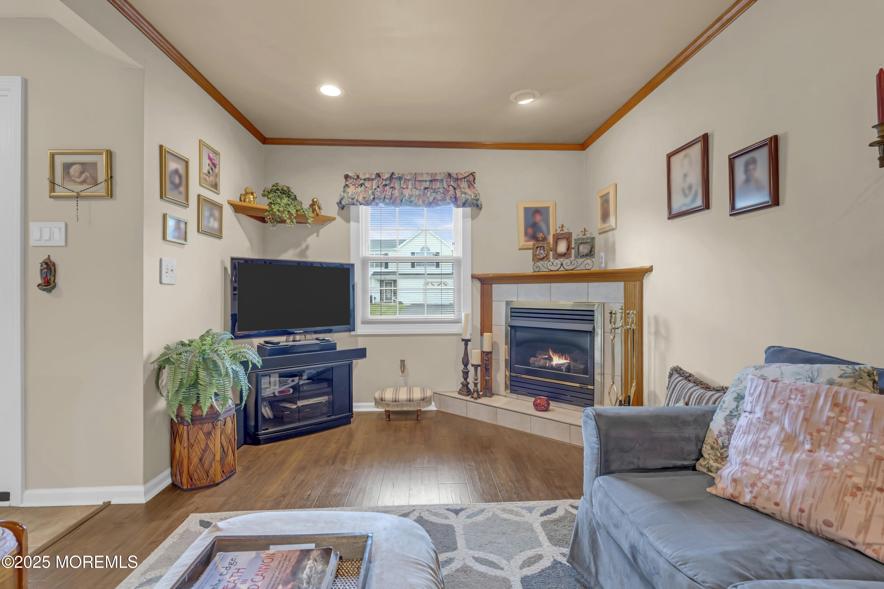 32 Kiwi Loop Howell, NJ 07731 - Photo 29 of 42 a living room with furniture and a fireplace