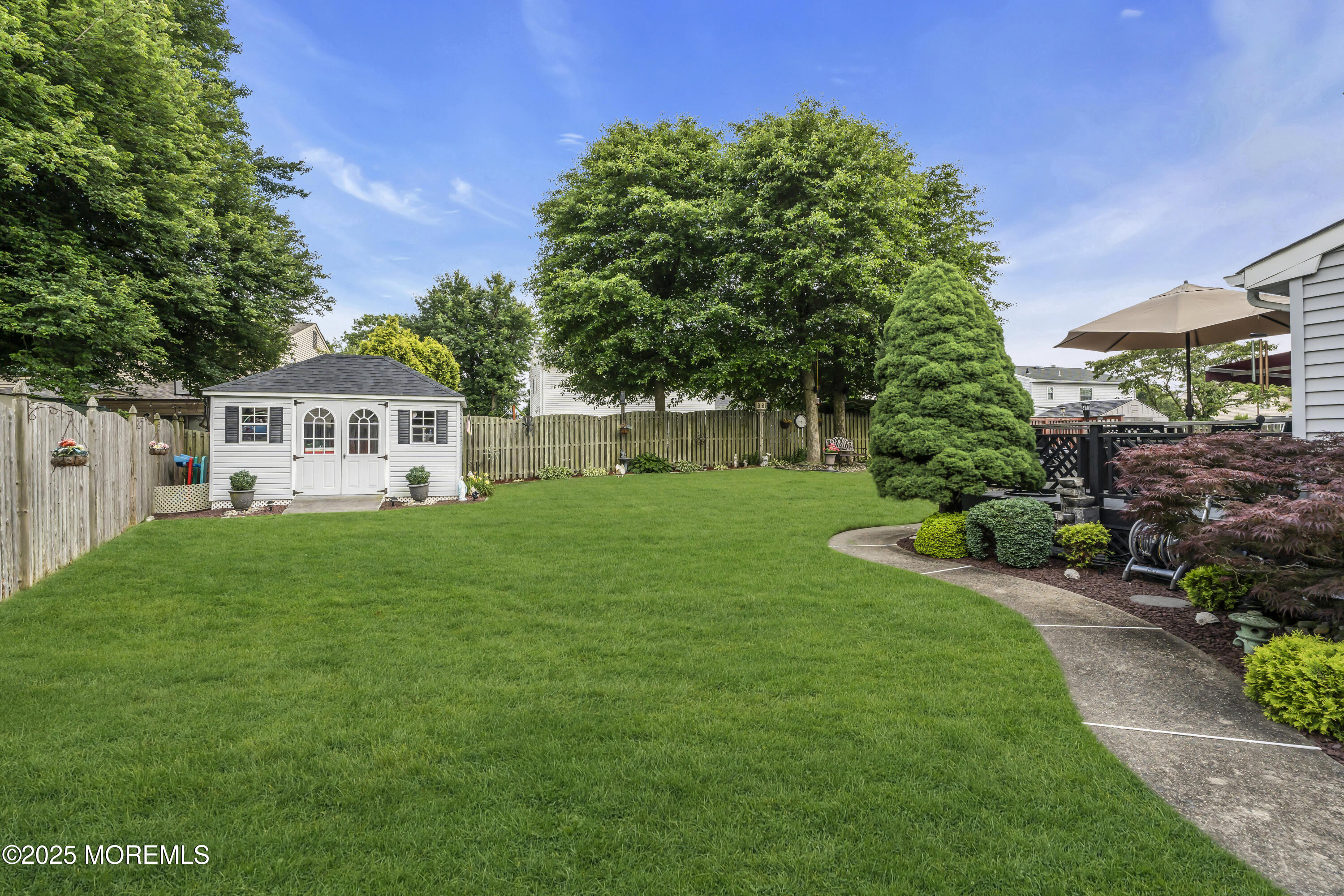 32 Kiwi Loop Howell, NJ 07731 - Photo 30 of 42 a front view of a house with a yard