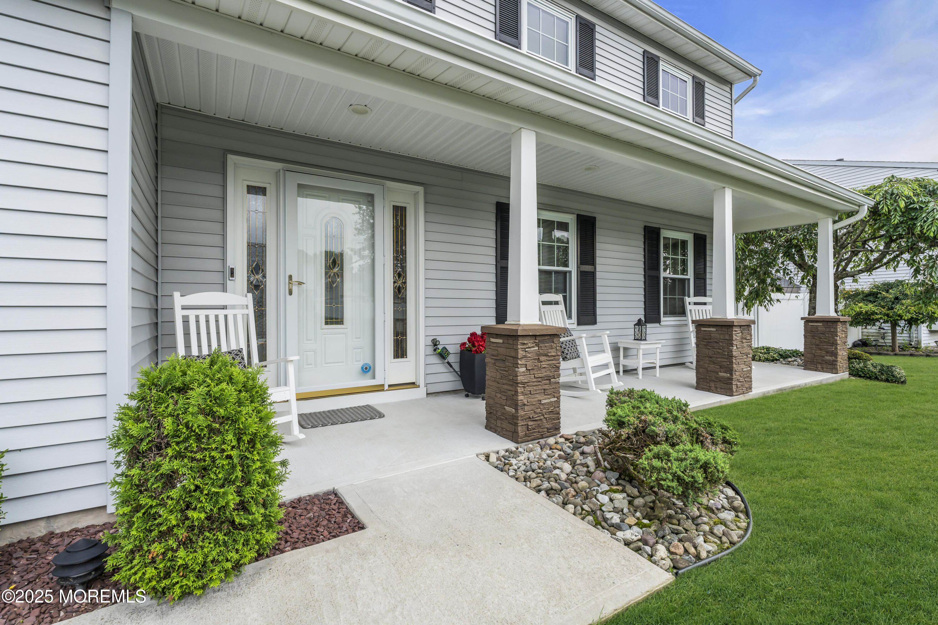 32 Kiwi Loop Howell, NJ 07731 - Photo 3 of 42 a front view of a house with garden