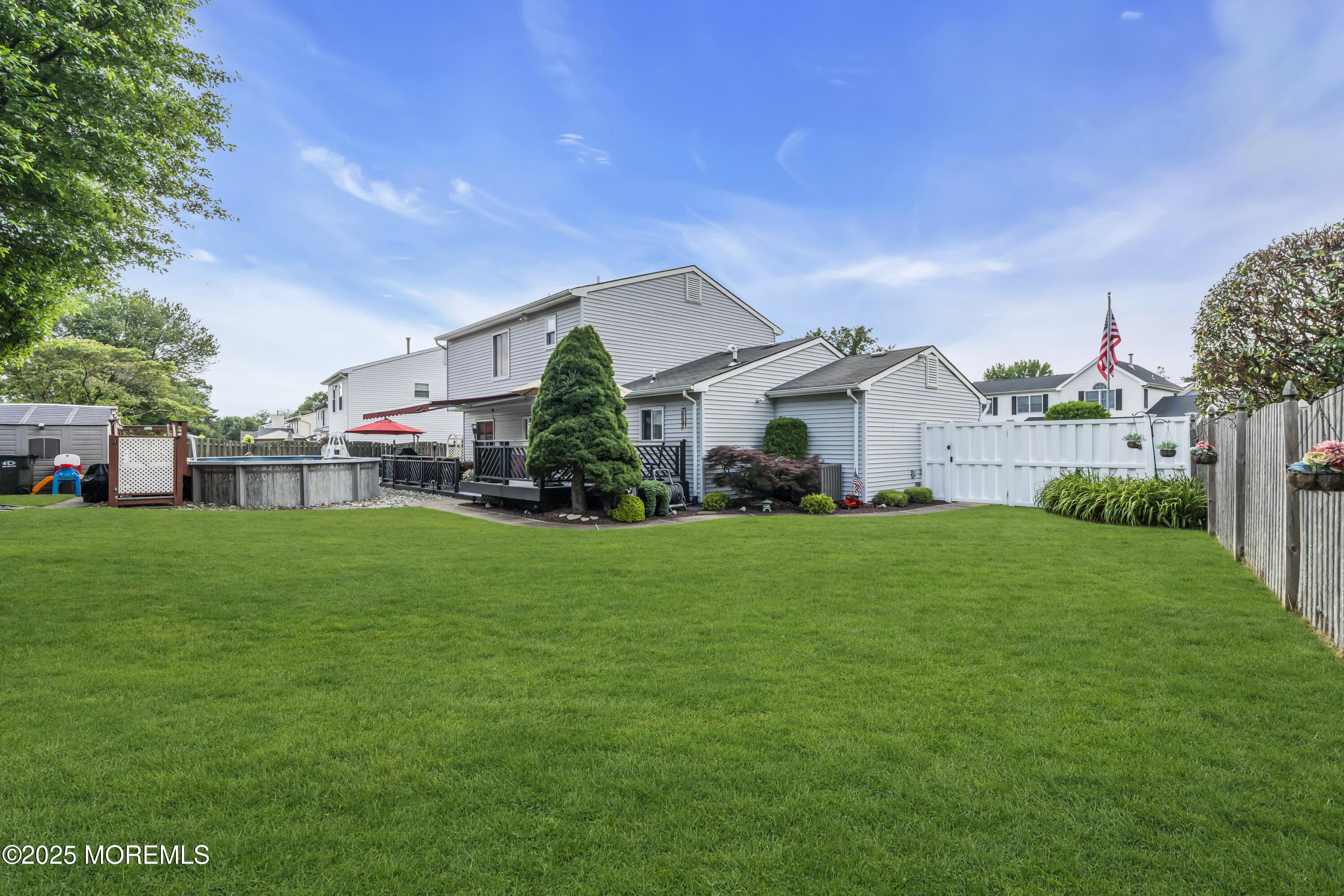 32 Kiwi Loop Howell, NJ 07731 - Photo 32 of 42 a front view of house with yard and green space