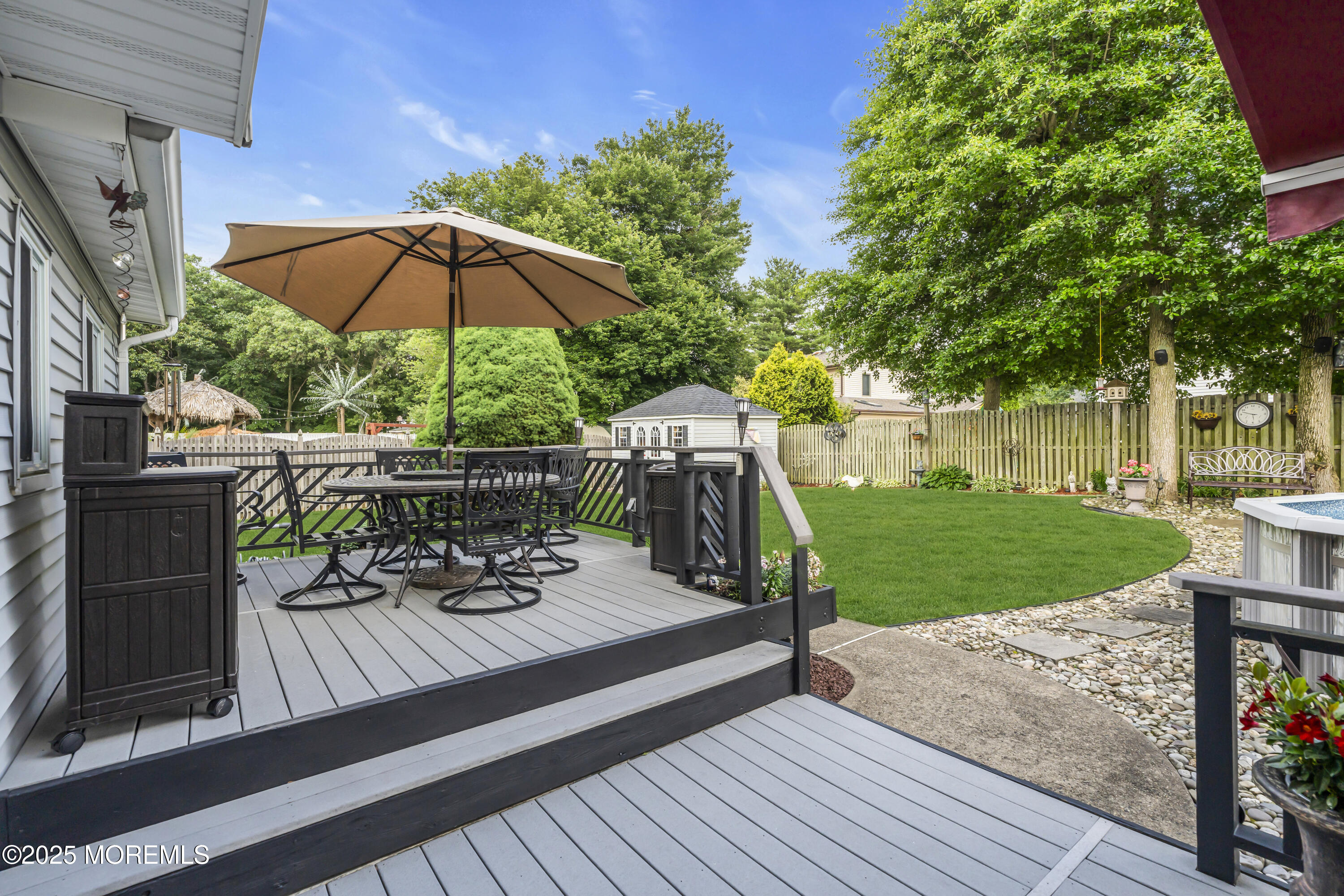 32 Kiwi Loop Howell, NJ 07731 - Photo 34 of 42 a view of a deck with furniture and a yard