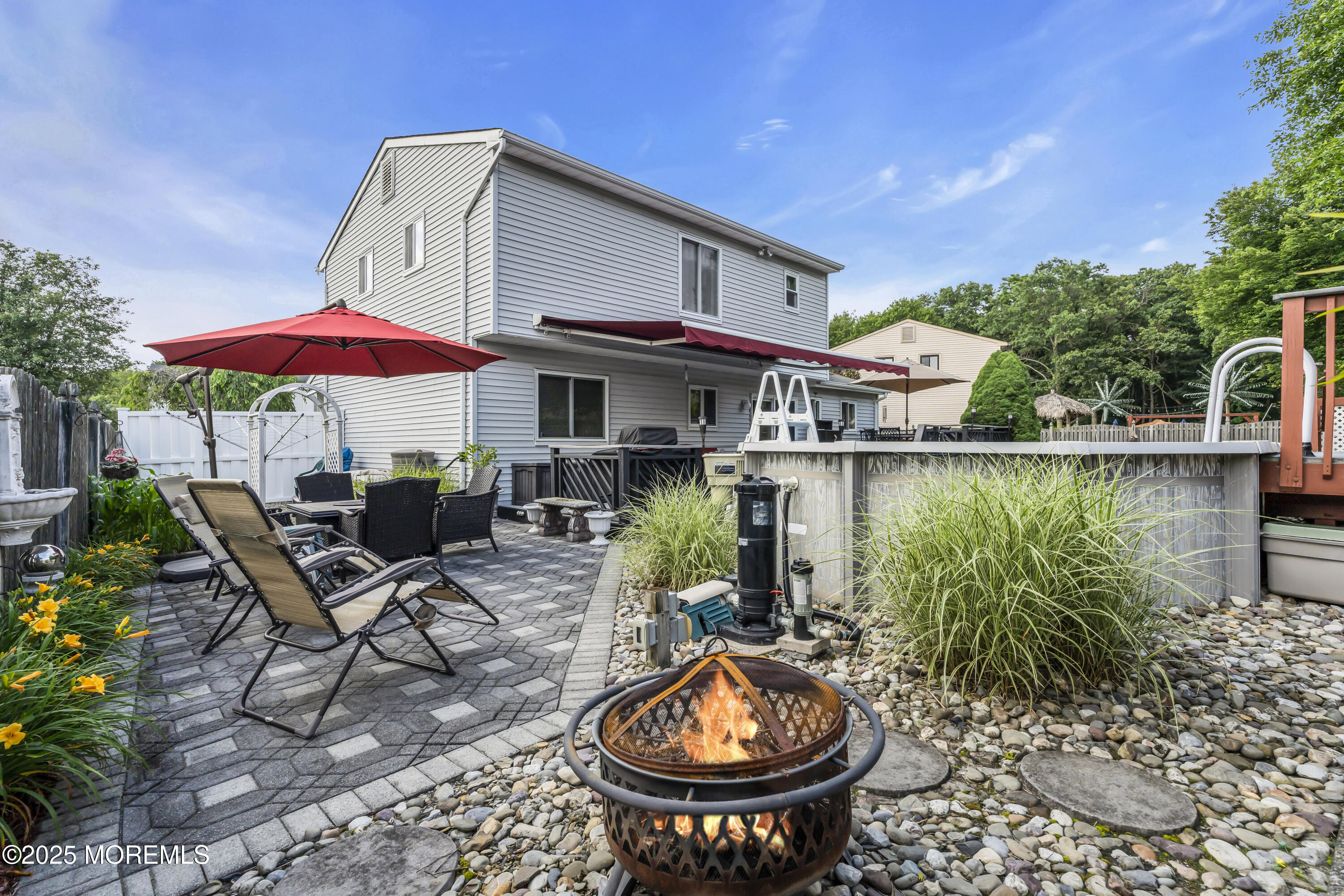 32 Kiwi Loop Howell, NJ 07731 - Photo 37 of 42 a backyard of a house with yard barbeque oven and outdoor seating