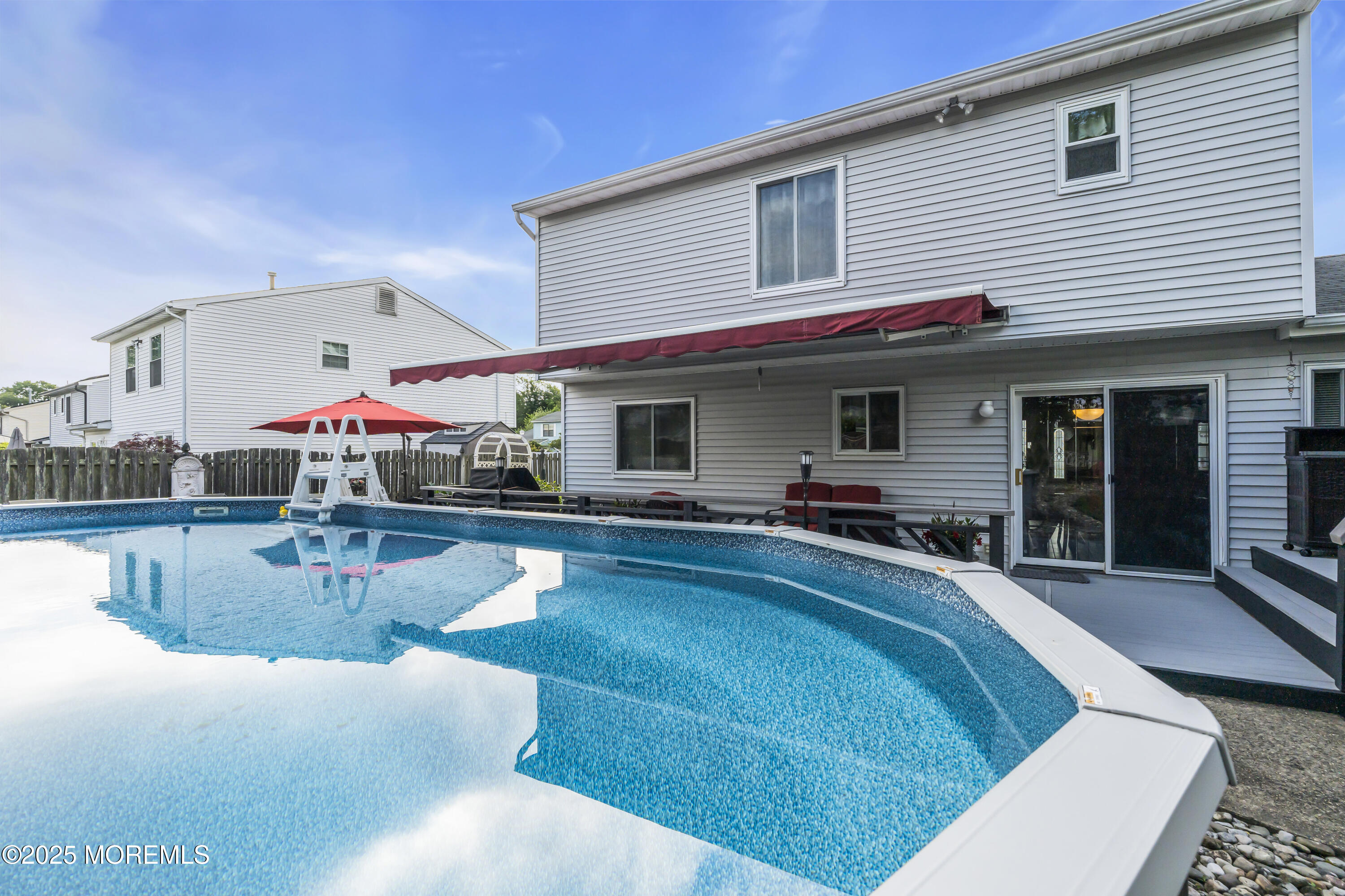 32 Kiwi Loop Howell, NJ 07731 - Photo 38 of 42 a swimming pool with outdoor seating