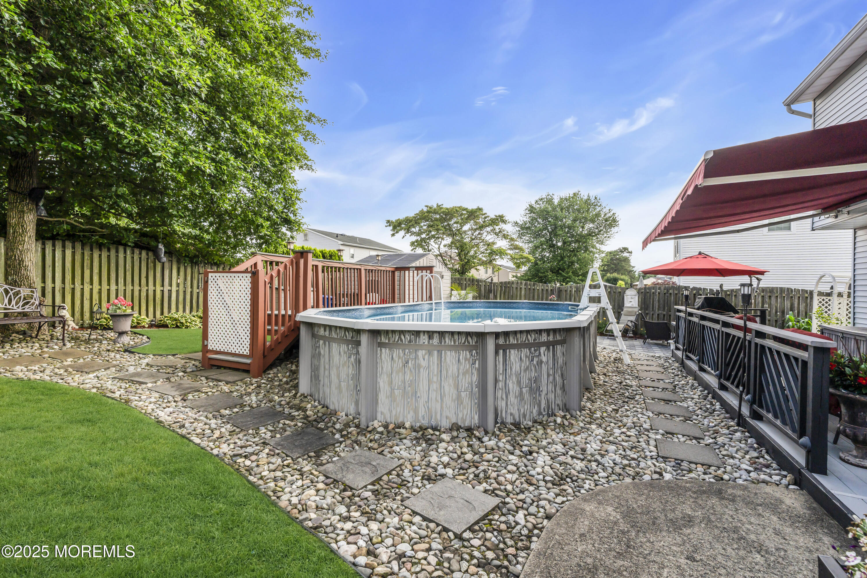 32 Kiwi Loop Howell, NJ 07731 - Photo 39 of 42 a view of a roof deck with wooden fence