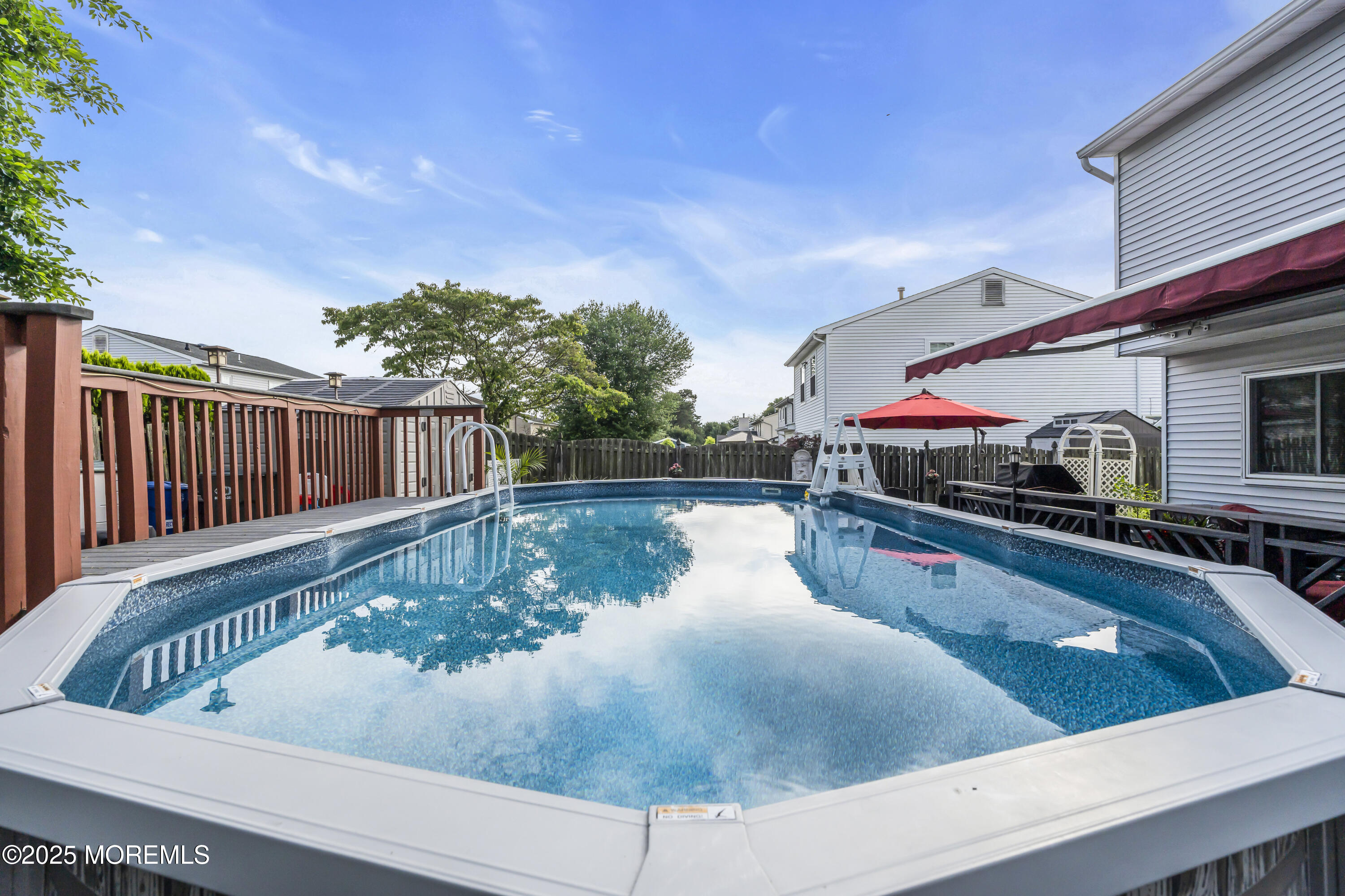 32 Kiwi Loop Howell, NJ 07731 - Photo 41 of 42 a view of swimming pool with outdoor seating and plants