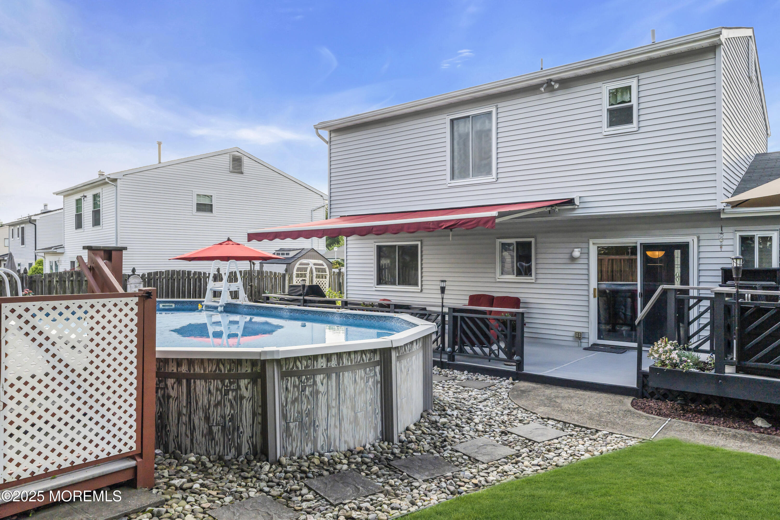 32 Kiwi Loop Howell, NJ 07731 - Photo 42 of 42 a view of a dinning table and chairs in patio