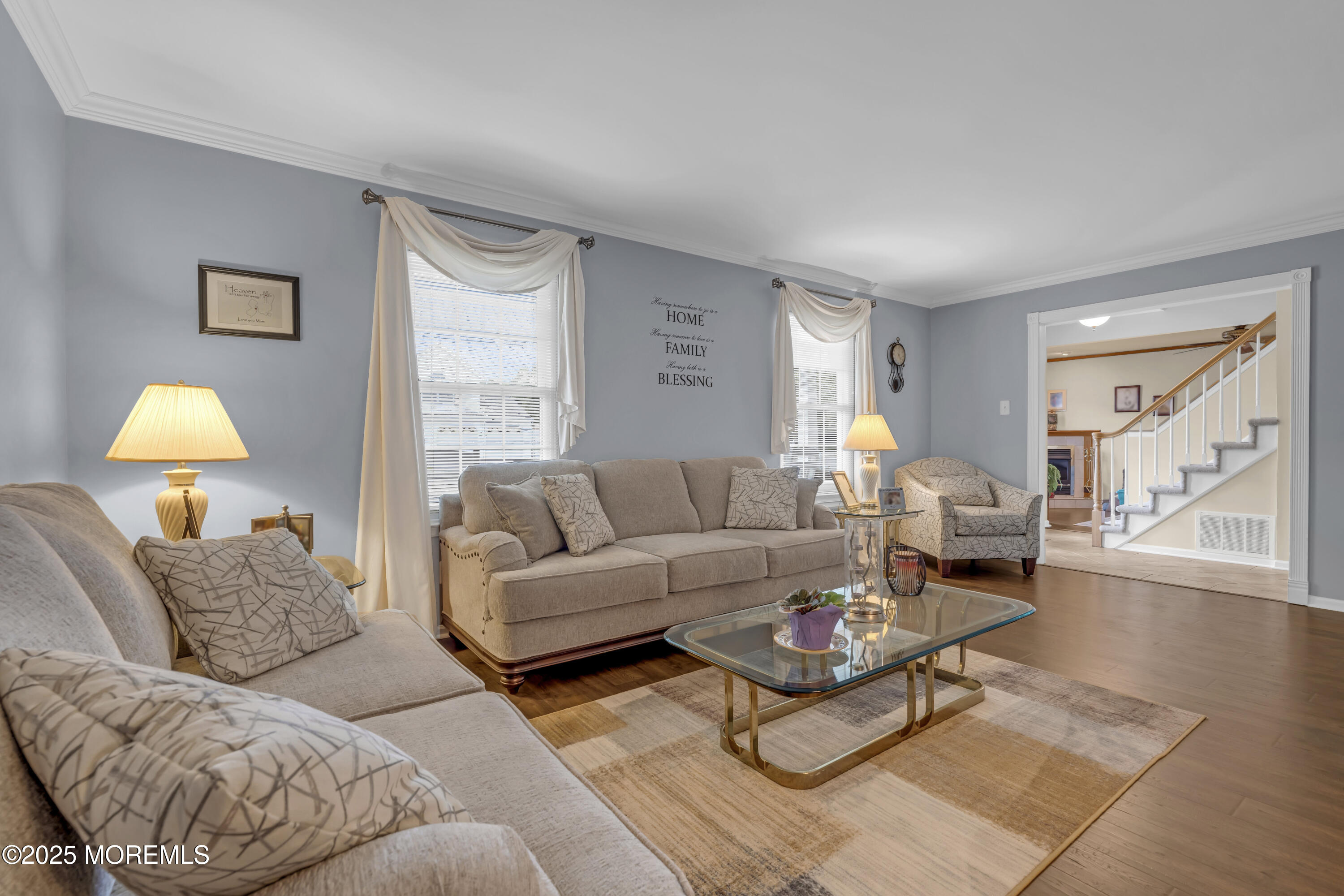 32 Kiwi Loop Howell, NJ 07731 - Photo 7 of 42 a living room with furniture and a lamp