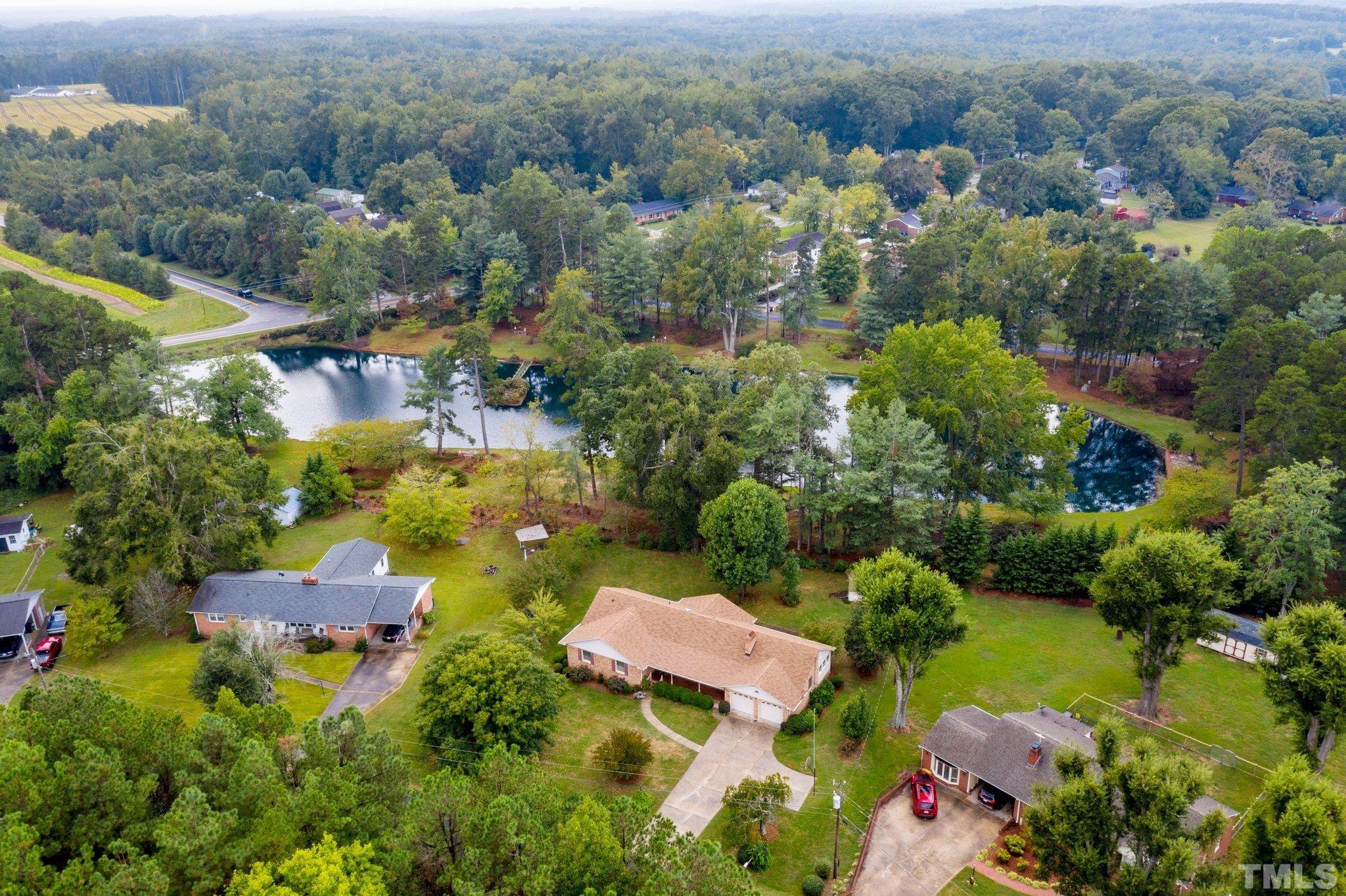 261 Badger Circle Roxboro, NC 27573 - Photo 2 of 30 an aerial view of residential houses with outdoor space and trees