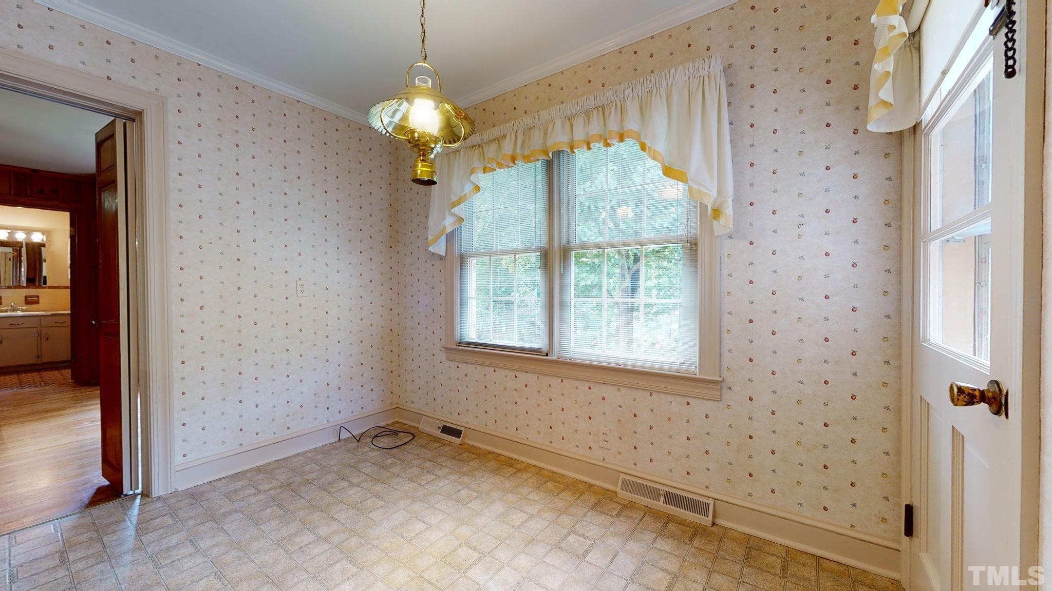 261 Badger Circle Roxboro, NC 27573 - Photo 11 of 30 a view of a room with a windows and a chandelier