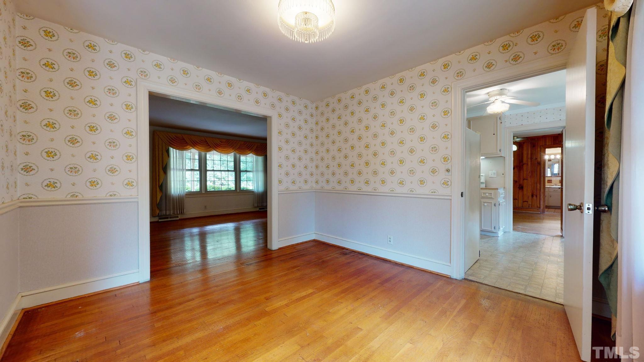 261 Badger Circle Roxboro, NC 27573 - Photo 13 of 30 wooden floor in an empty room with a window