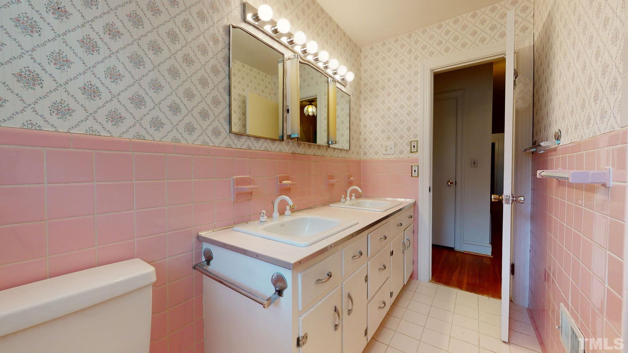 261 Badger Circle Roxboro, NC 27573 - Photo 19 of 30 a bathroom with a sink and a mirror