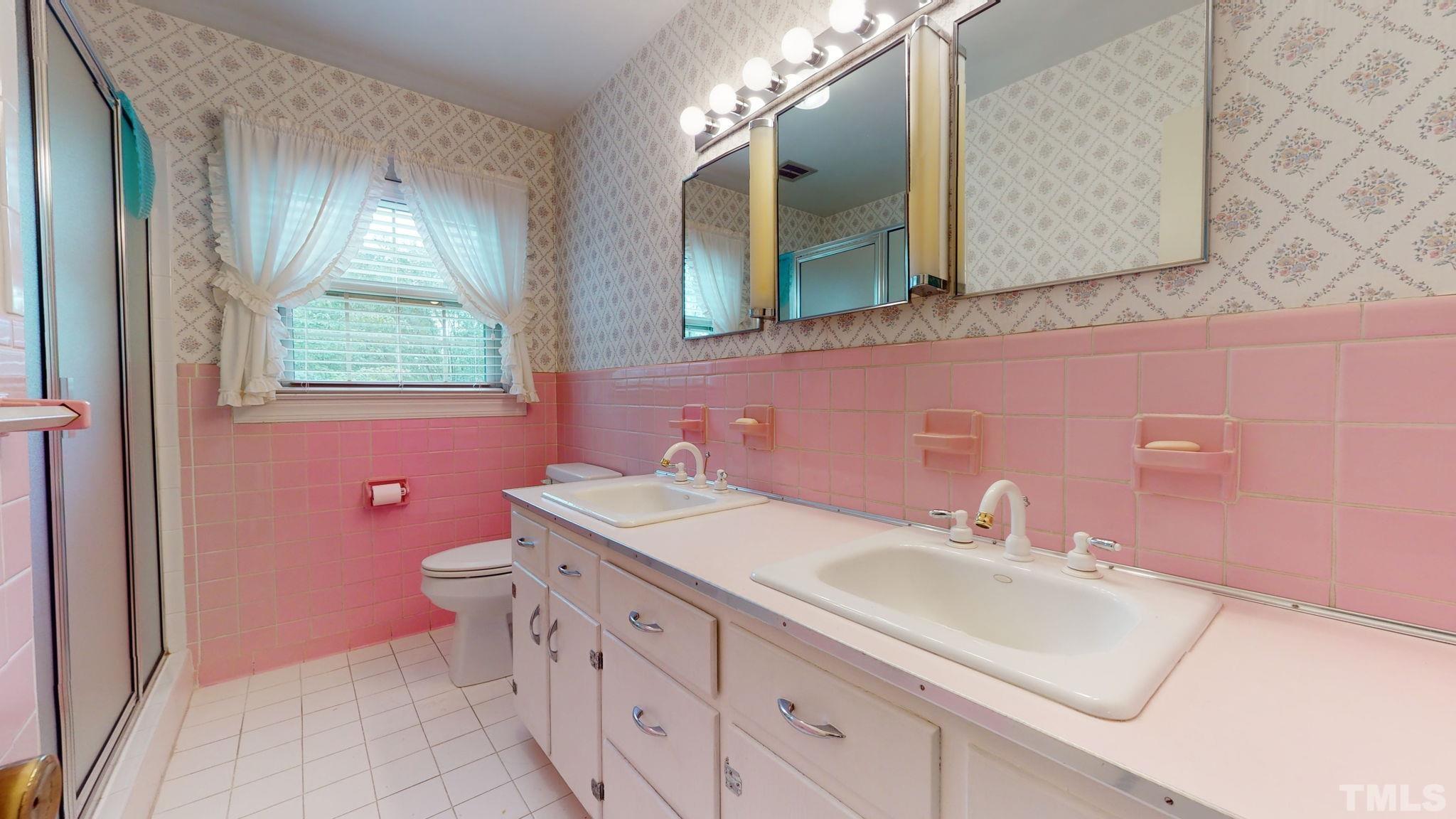 261 Badger Circle Roxboro, NC 27573 - Photo 20 of 30 a bathroom with a sink and a mirror