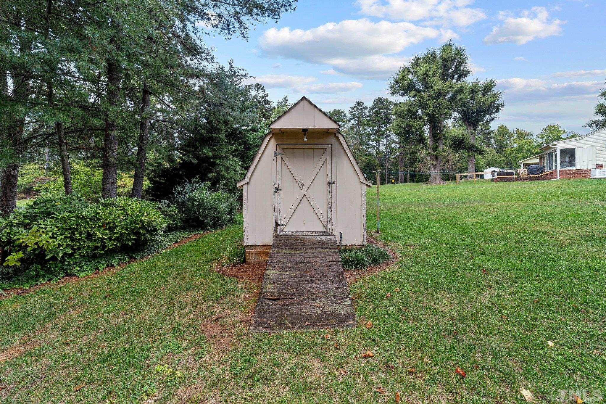261 Badger Circle Roxboro, NC 27573 - Photo 24 of 30 a view of backyard with garden and entertaining space