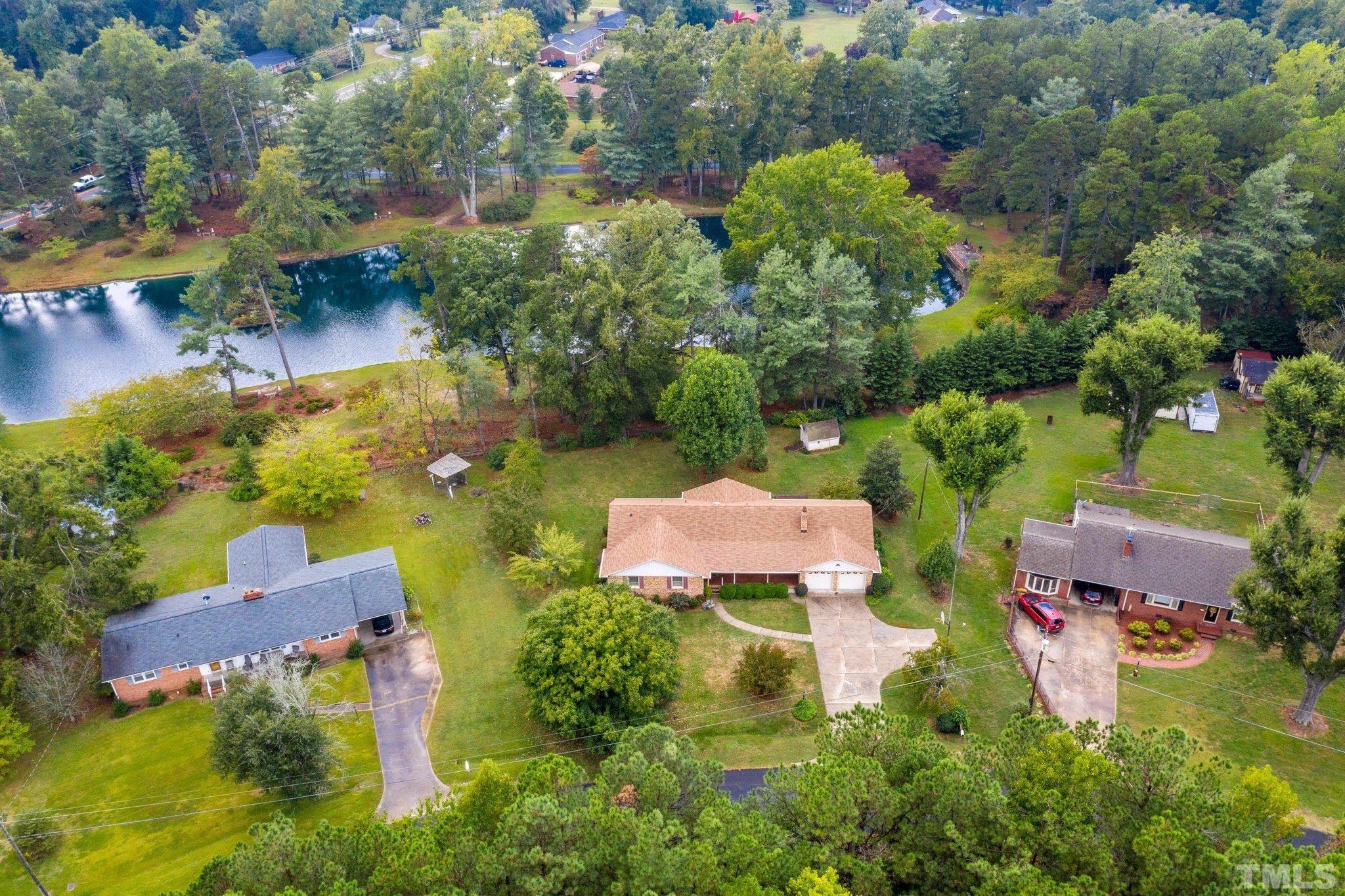 261 Badger Circle Roxboro, NC 27573 - Photo 25 of 30 an aerial view of a house with swimming pool and garden