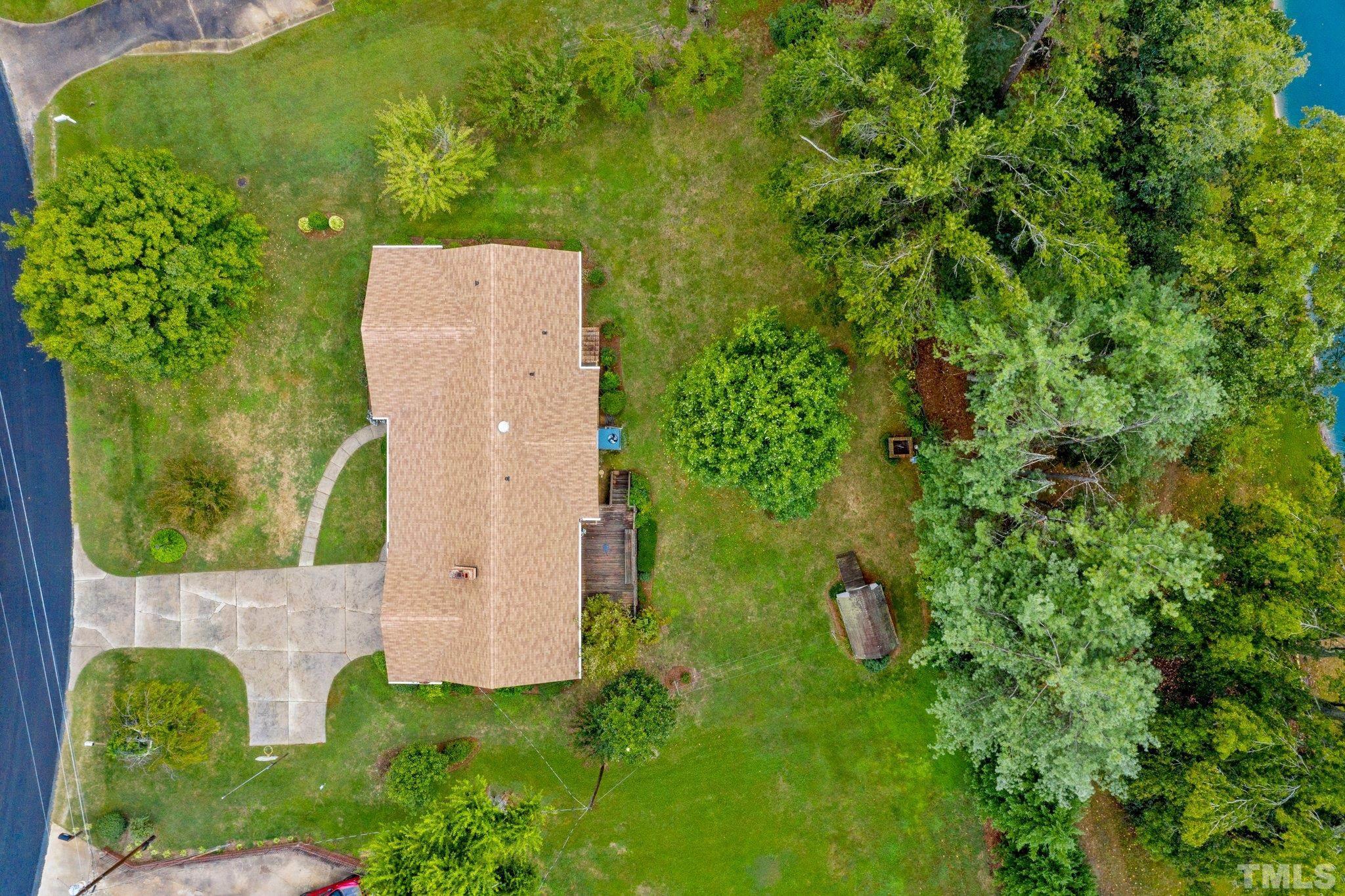 261 Badger Circle Roxboro, NC 27573 - Photo 29 of 30 an aerial view of a house with a yard and trees