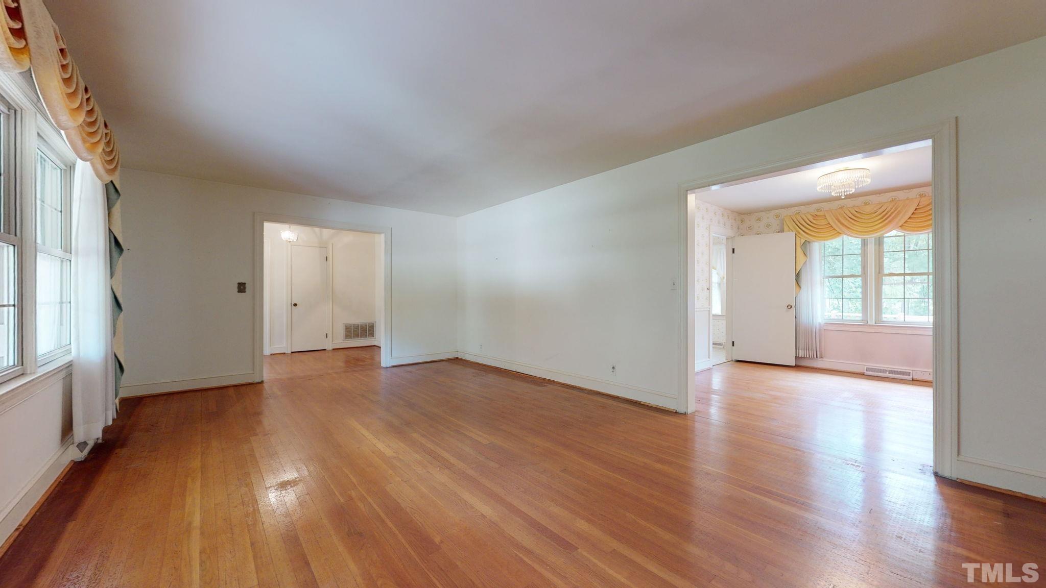 261 Badger Circle Roxboro, NC 27573 - Photo 4 of 30 wooden floor in an empty room with a window
