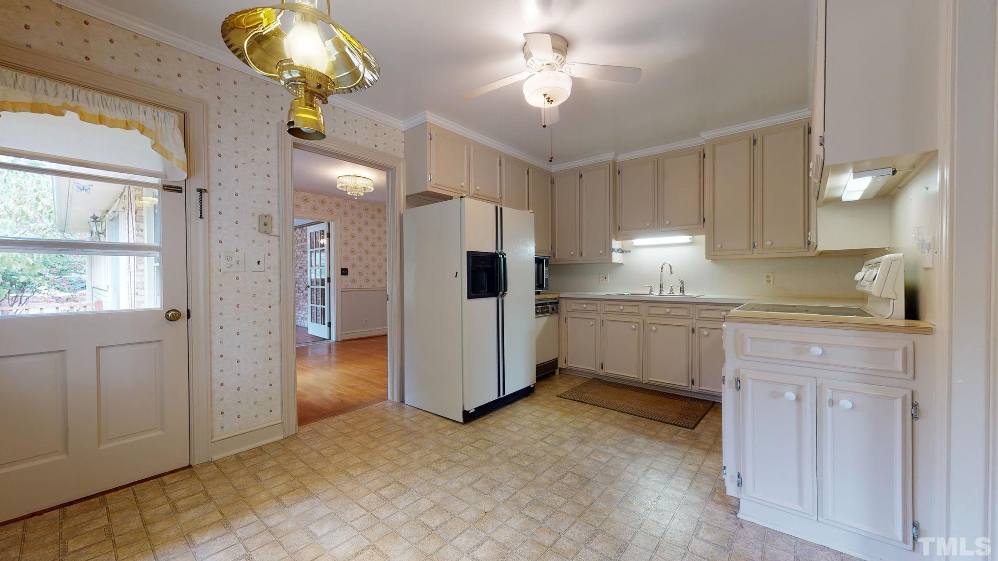 261 Badger Circle Roxboro, NC 27573 - Photo 8 of 30 a kitchen with cabinets and window