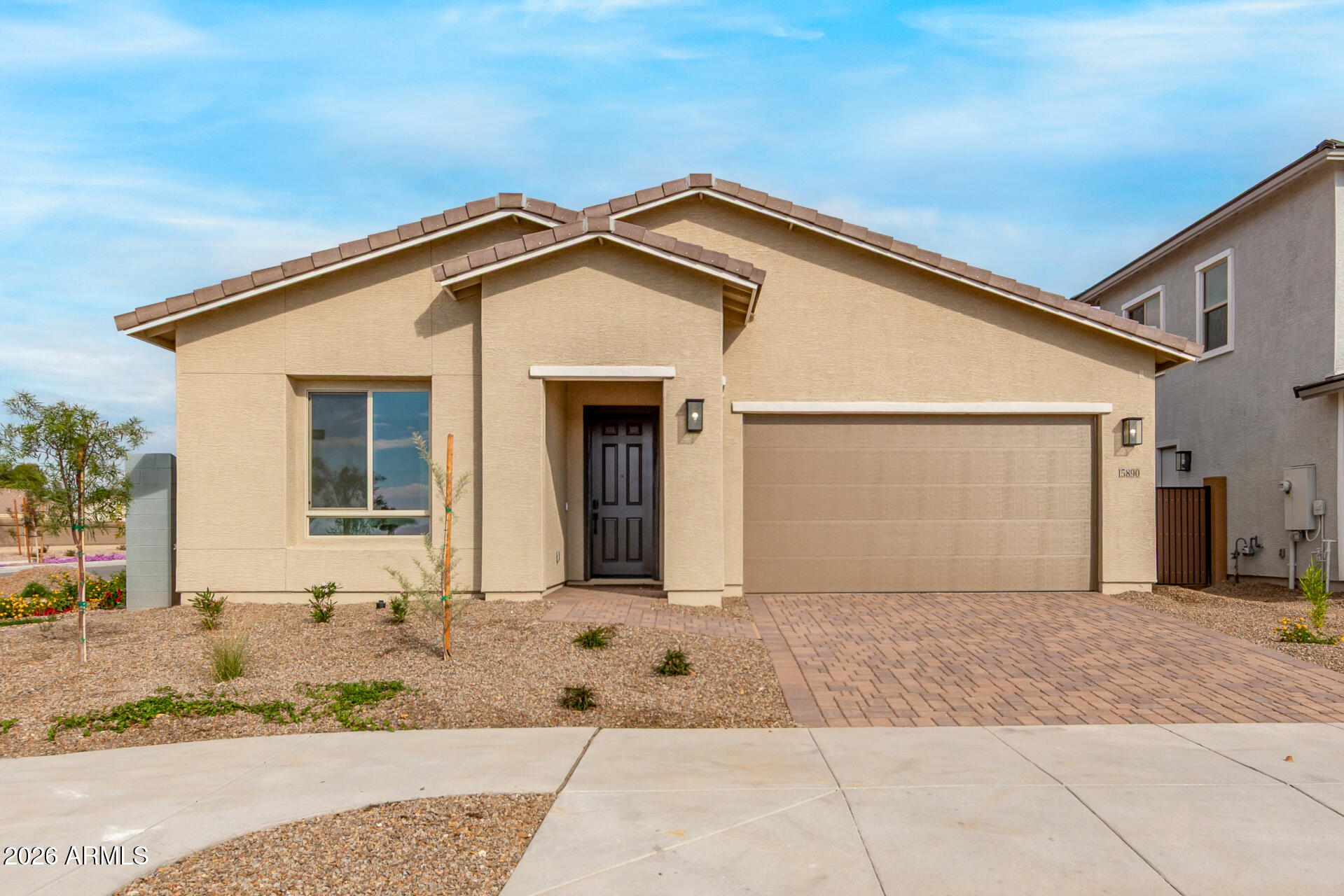 15890 West Miami Street Goodyear, AZ 85338 - Photo 1 of 51 a front view of a house with a yard and garage